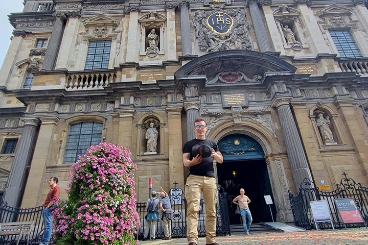 Alkestid standing in front of a building in Belgium.