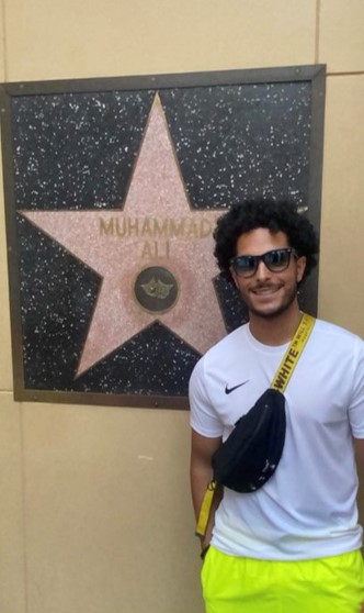 A student next to the star of Muhammad Ali