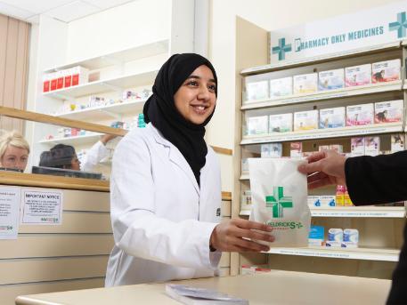 A student handing out a prescription