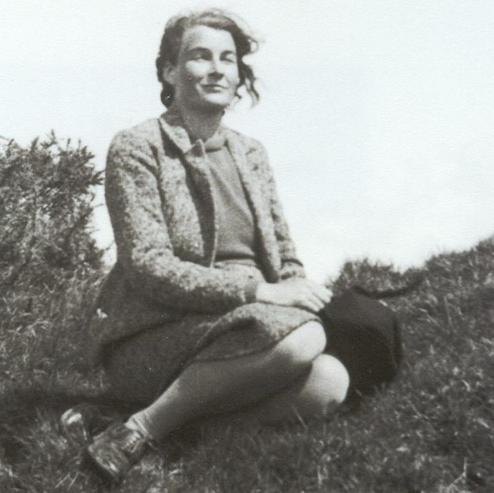 Jacquetta Hawkes sitting on grass, 1937