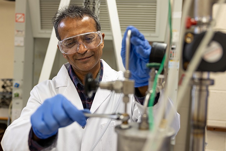Professor Raj Patel with lab equipment.