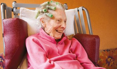 Elderly person smiling.