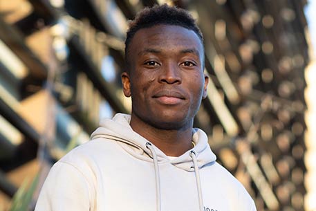 A student smiling at the camera.