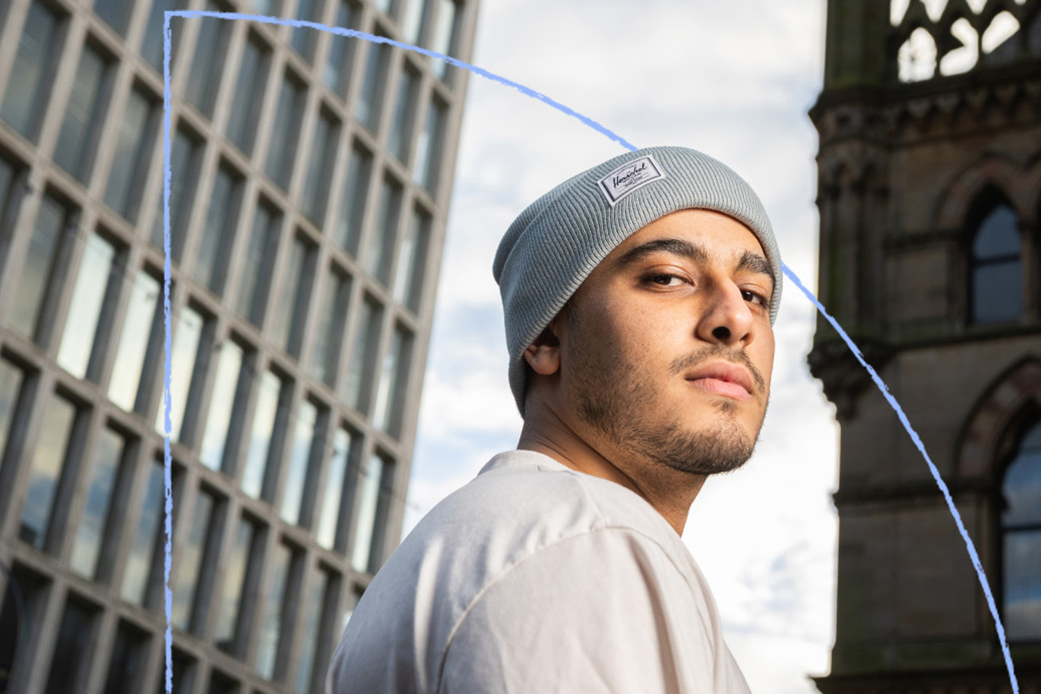 A student posing in City Square in Bradford City Centre.