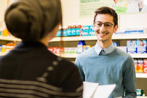 Generic picture of a customer being served in a pharmacy Generic picture of a customer being served in a pharmacy