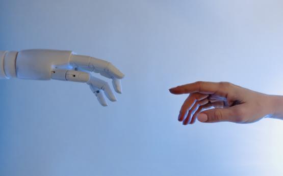 Robot hand reaching for human hand Robot hand reaching for human hand