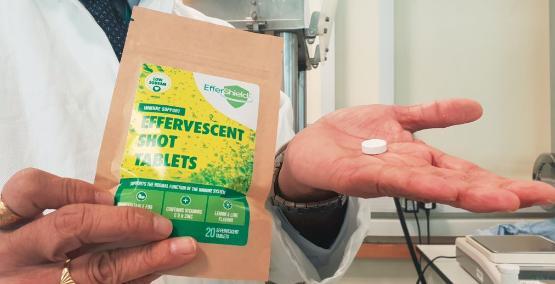 Person holding an effervescent tablet Person holding an effervescent tablet