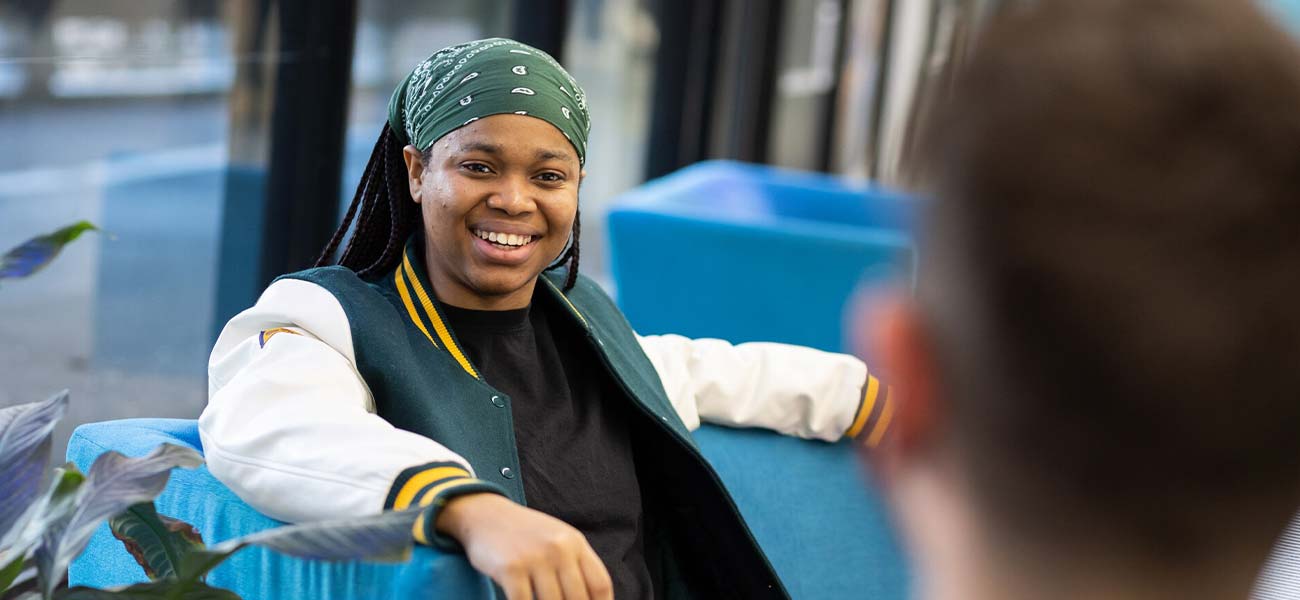 A student smiling at the camera