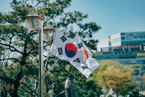 South Korean flag on a windy, clear day. (Unsplash)