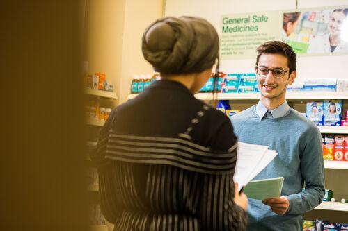Student pharmacist practising engaging with a customer Student pharmacist practising engaging with a customer