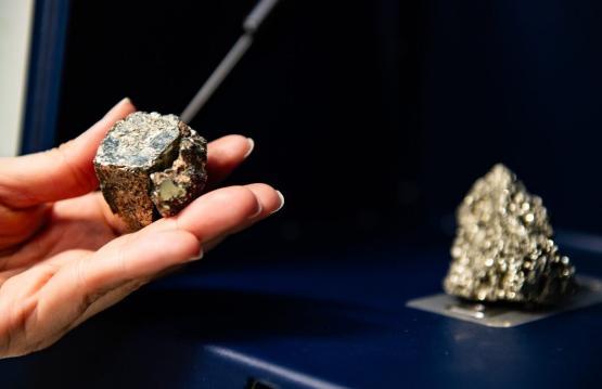 Person handling fools gold sample Person handling fools gold sample