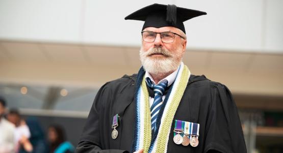 Sean Cahill graduating wearing war medals Sean Cahill graduating wearing war medals