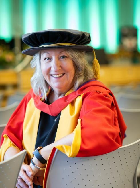 Honorary graduate Rebecca George wearing robes Honorary graduate Rebecca George wearing robes
