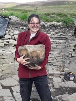 Person holding whale verterba Person holding whale verterba
