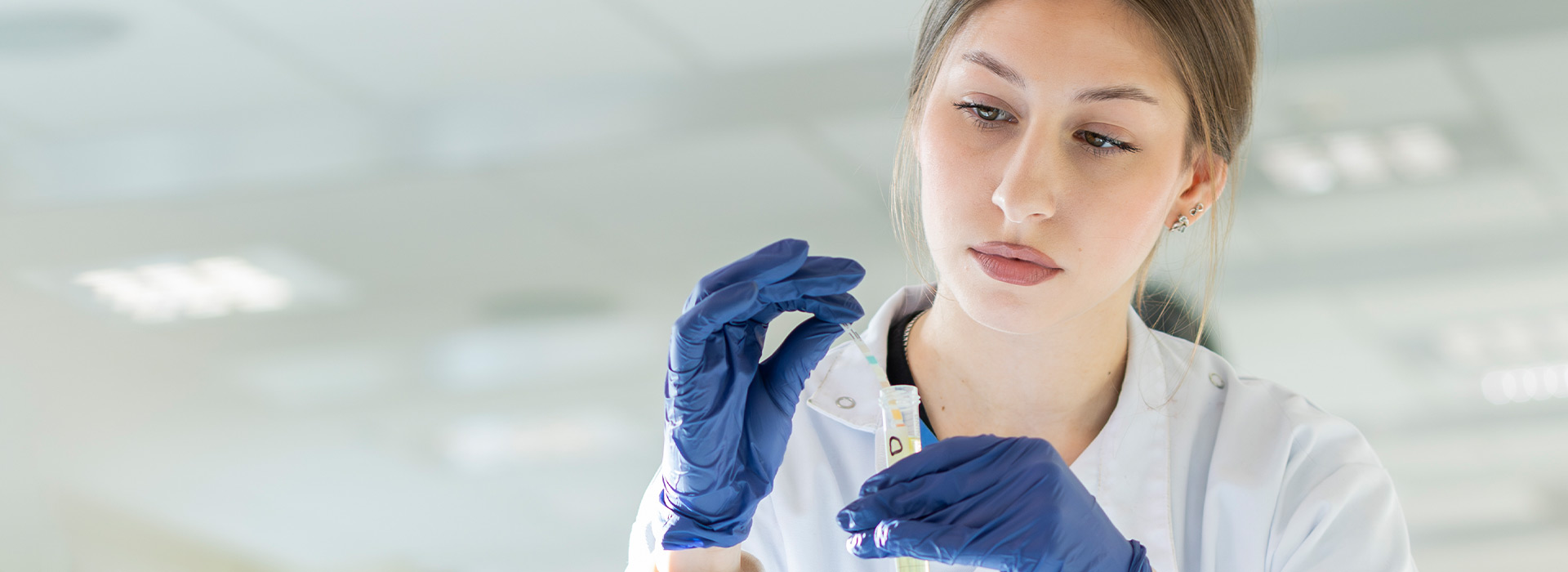 A pharmacy student performing experiments.