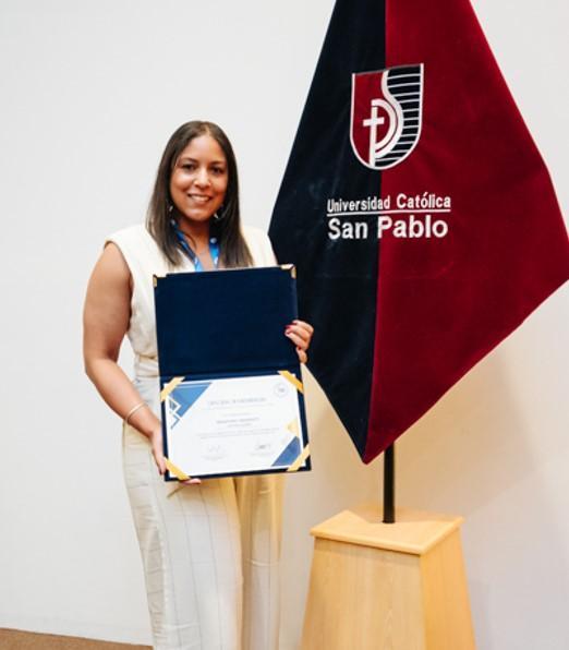 Dr Rachel Sammut holding the CLADEA award