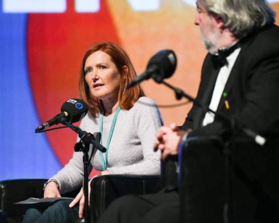 Dr Karen Thornton sitting in front of a microphone Dr Karen Thornton sitting in front of a microphone