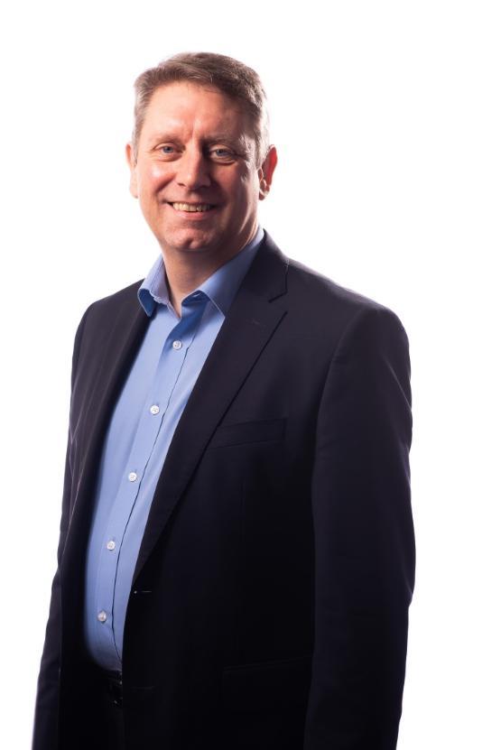 a head and shoulders shot of staff member in shirt and jacket a head and shoulders shot of staff member in shirt and jacket