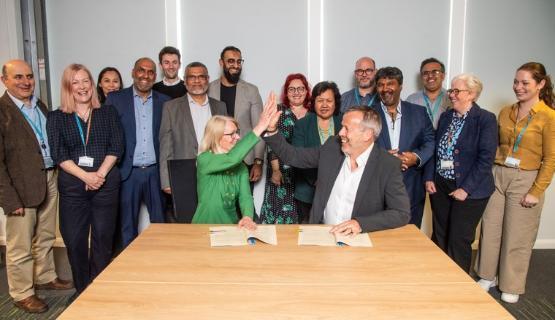 Professor Shirley Congdon and Neil Kirby with other partnership members behind Professor Shirley Congdon and Neil Kirby with other partnership members behind