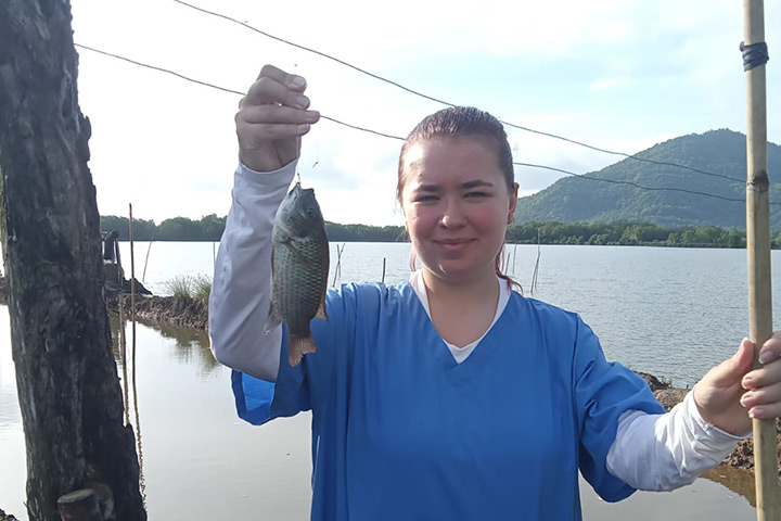 Courtney holding a fish. Courtney holding a fish.