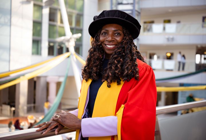 Person graduates in formal gown