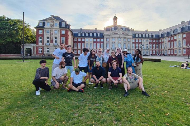 Alkestid posing with fellow classmates in Germany.