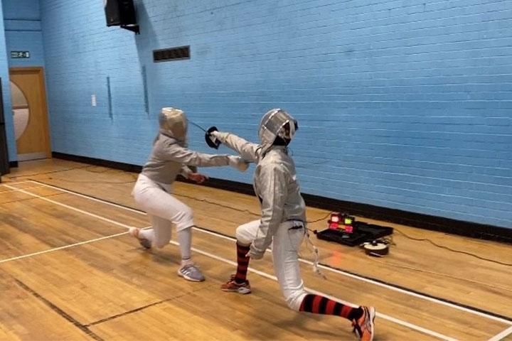 Serena partaking in a fencing competition.