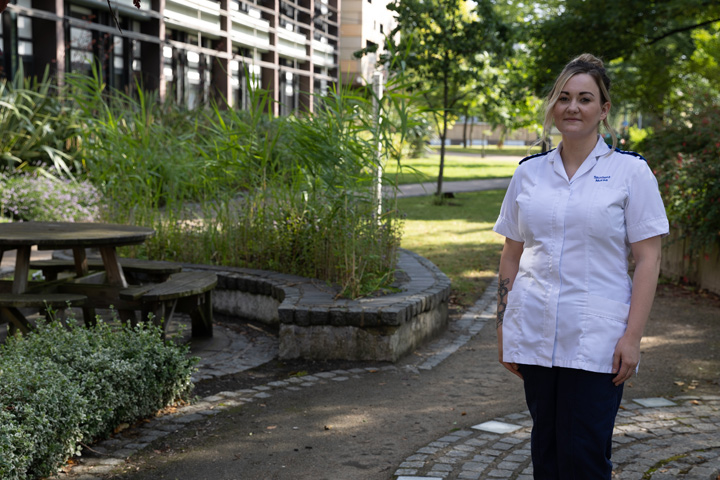 Child Nursing student, Demi-Jo Morgan, in uniform, stood in the Peace Garden