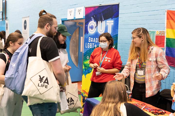 Students gathering at an LGBT+ stand at Freshers fair 2021.
