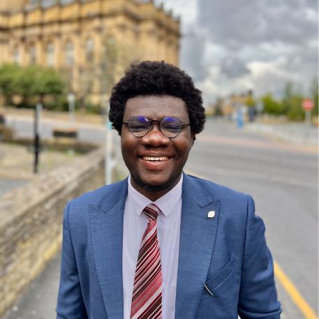 David Owumi, 2021 graduate/alumnus of MSc Sustainable Development, Peace Studies and International Development, professional photo taken in Bradford City.