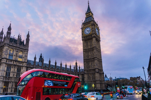 Big Ben and red London bus, England. (Unsplash)