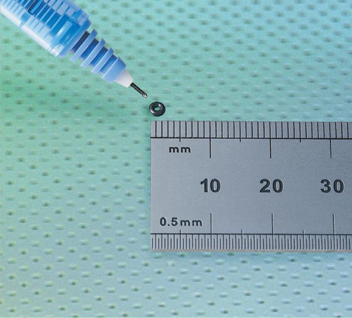 micro polymer product alongside a ruler