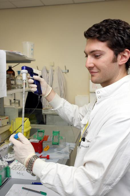 Scientist using laboratory equipment