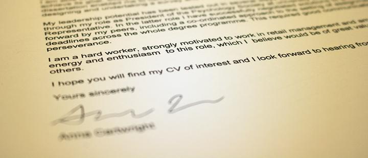 a close up on covering letter with yellow tint
