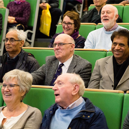 An audience sitting in a lecture theatre