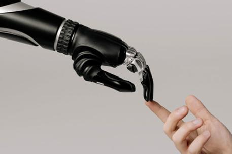 A bionic hand and touching a human hand