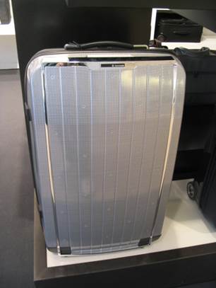 Silver travel suitcase.