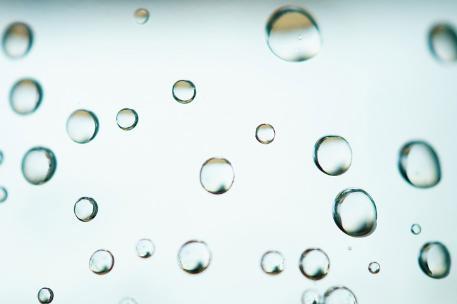Clear water bubbles on a window pane