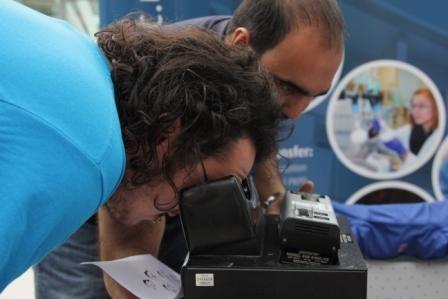 Two men examining DNA using equipment