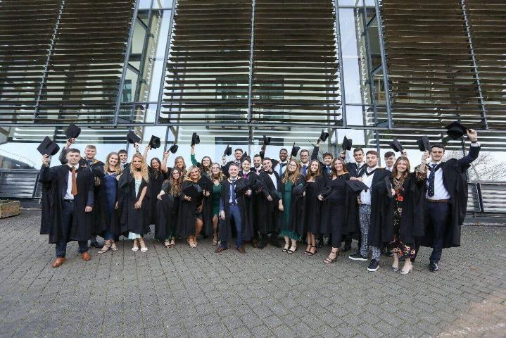 A photo of graduates from the Morrisons Degree Apprenticeship cohort celebrating