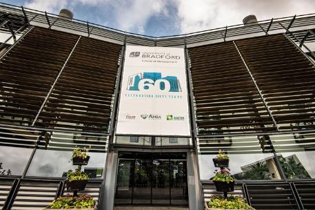 Bright Building with School of Management 60th Anniversary Banner
