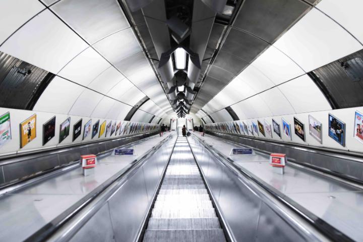 Underground escalator with multiple adverts