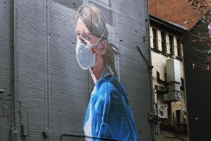 Mural of a nurse called Melanie in Manchester. Painted by Pete Barber, original photograph by Johannah Churchill.