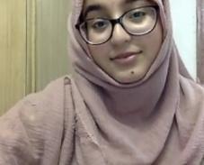 BSc Biomedical Science student wearing headscarf and glasses