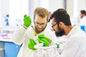 two male students working in a lab