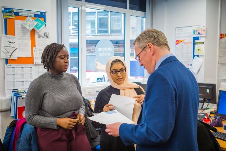 Law students get advice about a complex case from a tutor at the Law Clinic, Citizens Advice Bradford