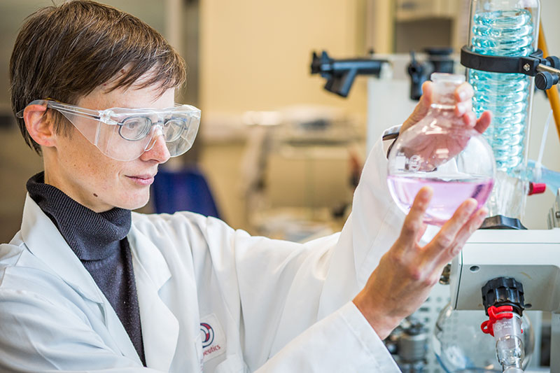 A female student working in a scientific laboratory.