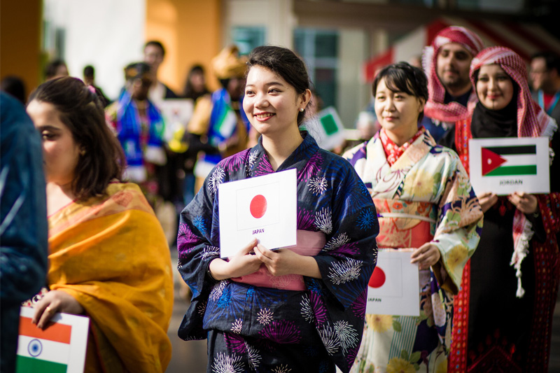 International students participating in a costume parade as a part of the One World Week Festival 2017