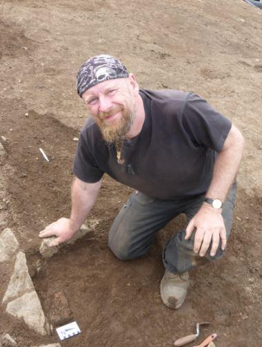 Dr Michael Copper, from the University of Bradford's School of Archaeological and Forensic Sciences, pictured at an archaeological dig site