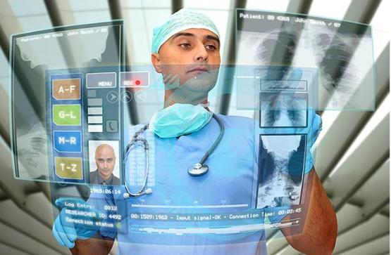 A health professional using a hi-tech computer dashboard